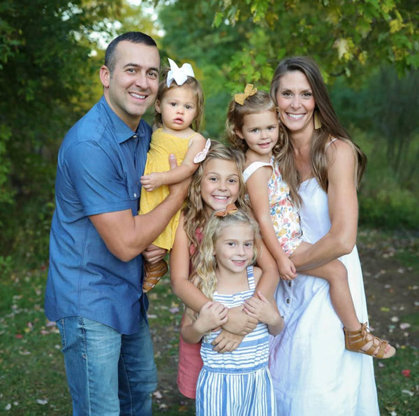 Joel Lederman, co-owner of Elevation Park Model Company, with his wife and children
