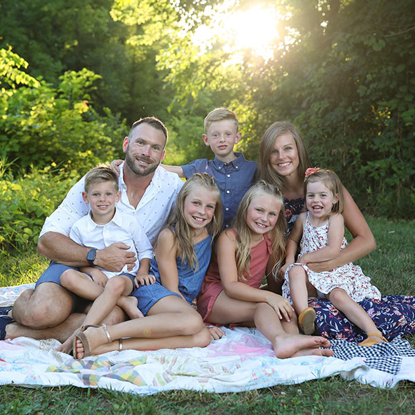 Elevation Park Models' Plant Manager Josh Walter with his wife, three daughters, and two sons.